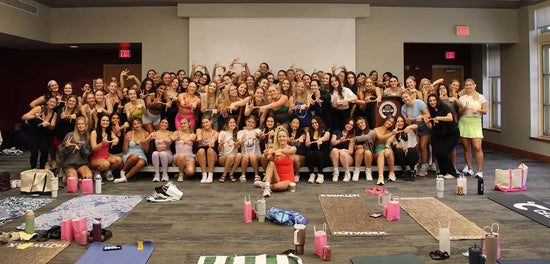 be well with britt event, photo of britt and college women after yoga class