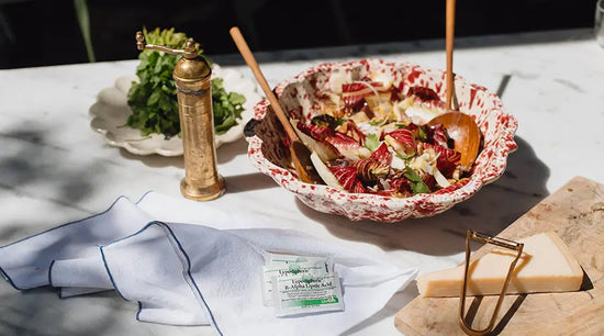 thanksgiving salad in a bowl on a table with packets of lypo-spheric r-alpha lipoic acid