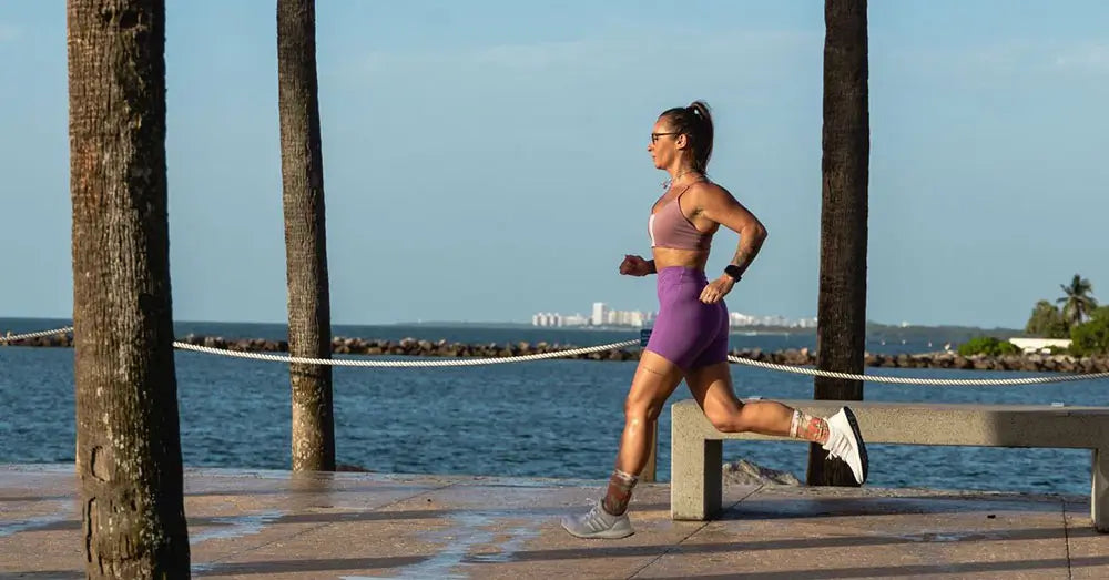 sabrina wieser running along a beach