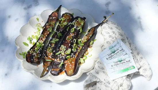 miso eggplant on a plate with packets of lypo-spheric r-alpha lipoic acid